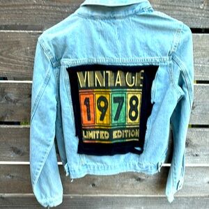 Distressed denim jacket